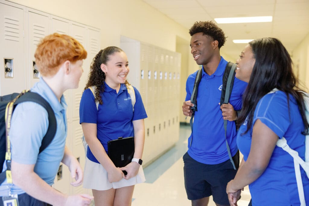 The First Academy students chatting in the hall