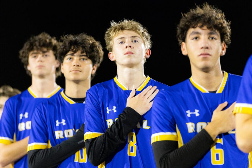 The First Academy sports team at an event