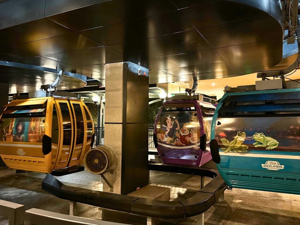 Three Disney skyliners in station at night - image by Dani Meyering