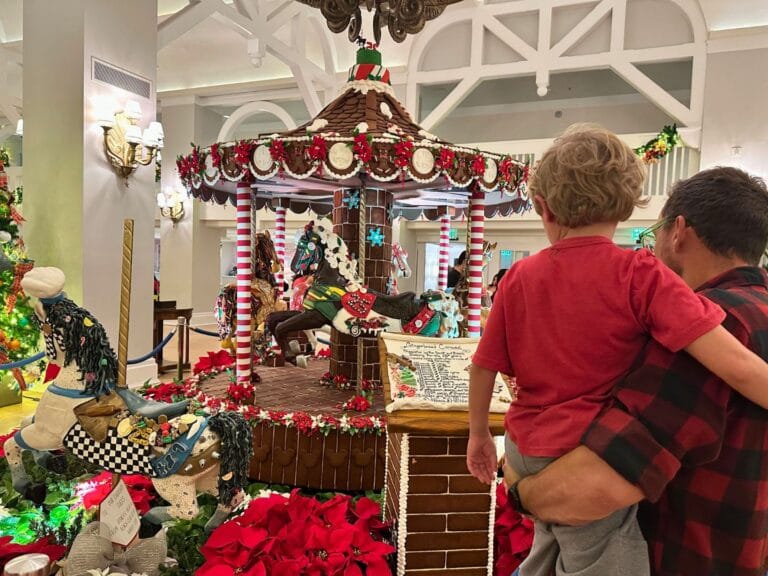 father and son at Beach Club Gingerbread Carousel - image by Dani Meyering