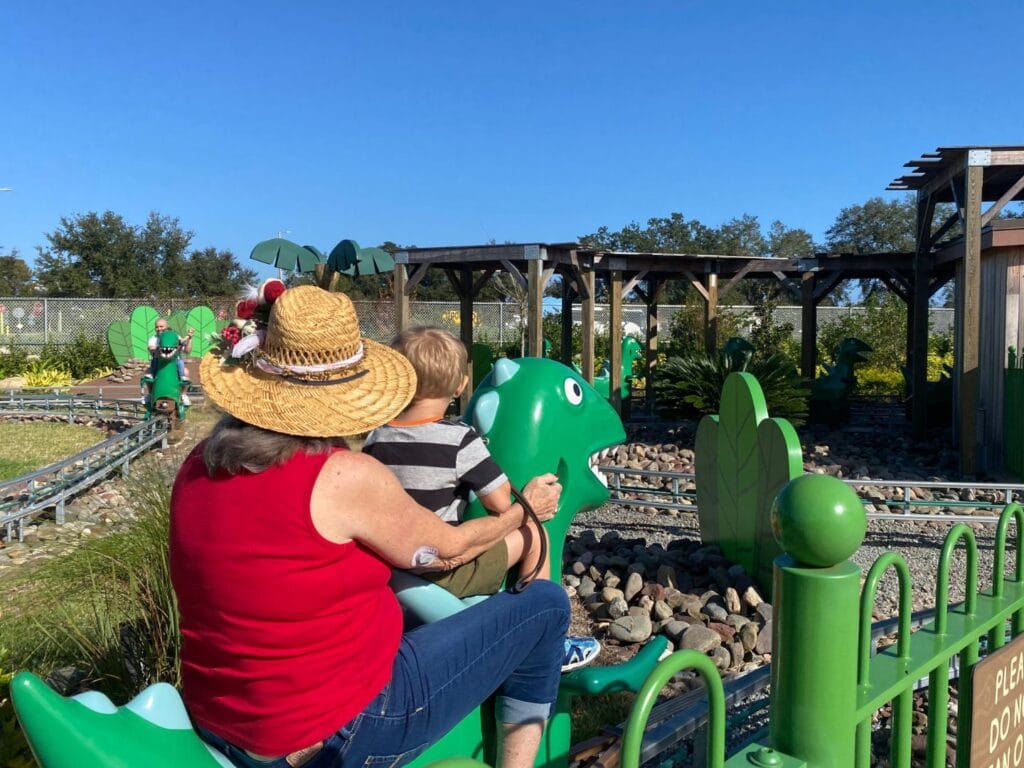 young boy at Peppa Pig Theme Park grampy rabbit's dinosaur adventure - image by Dani Meyering