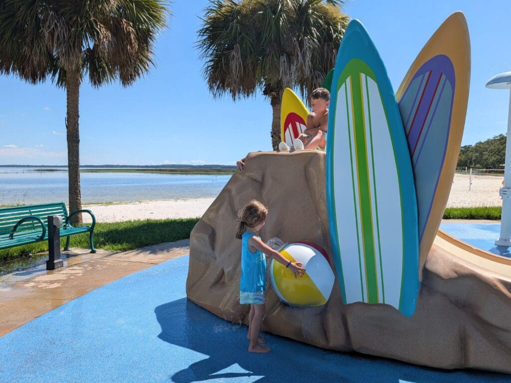 young girl at Lakefront Park Splash Pad St. Cloud - image by Maria DiCicco comp