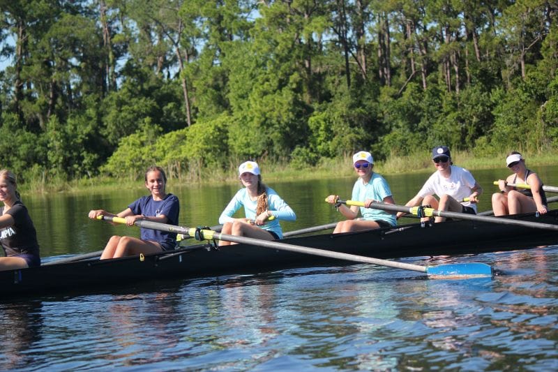 Orlando Area Rowing Society OARS campers smiling for picture in canoe