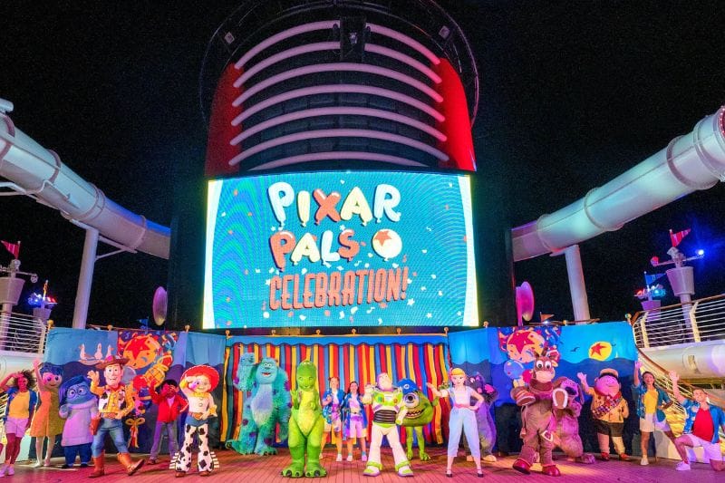 pixar characters on stage on disney cruise line