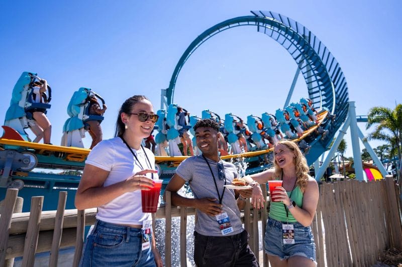 Seven Seas Food Festival SeaWorld Orlando three young guests in front of Pipeline Coaster - image provided by SeaWorld Orlando