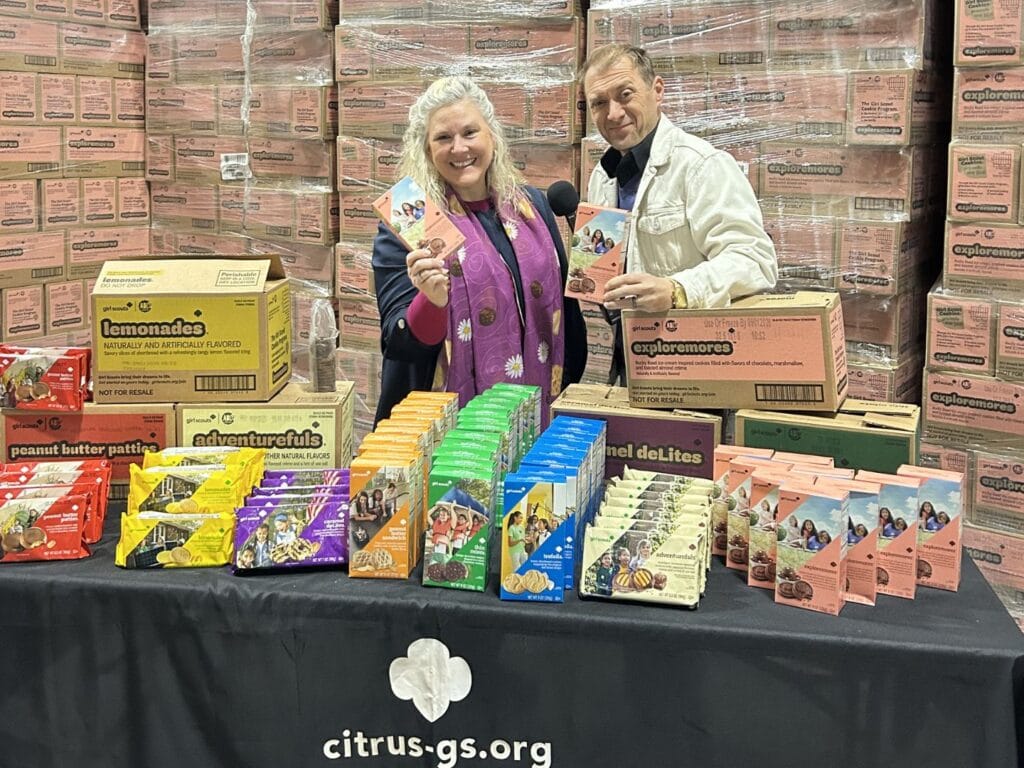Girl Scouts of Citrus pose in warehouse with Fox35