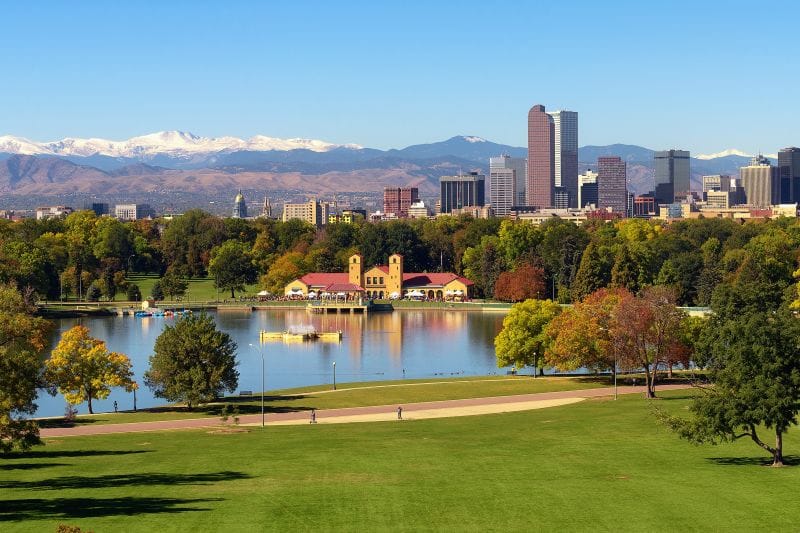 The Denver skyline with a lake in front of it AdobeStock_237712616