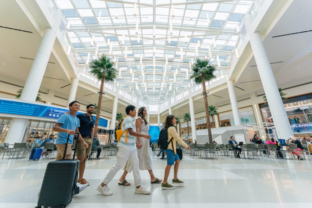 Family walking in the MCO airport