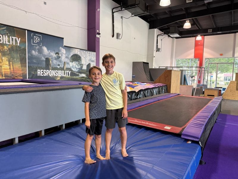 2 boys posing on an athletic mat at Urban Youth Park in Orlando