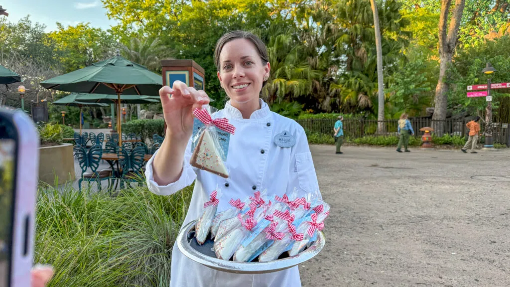 Chef Kellie Matthews presents a sample of the Fairy Cake Bread, a smaller version of what you can now buy at Pizzafari at Disney's Animal Kingdom in honor of the opening of Bluey's Wild World at Conservation Station.