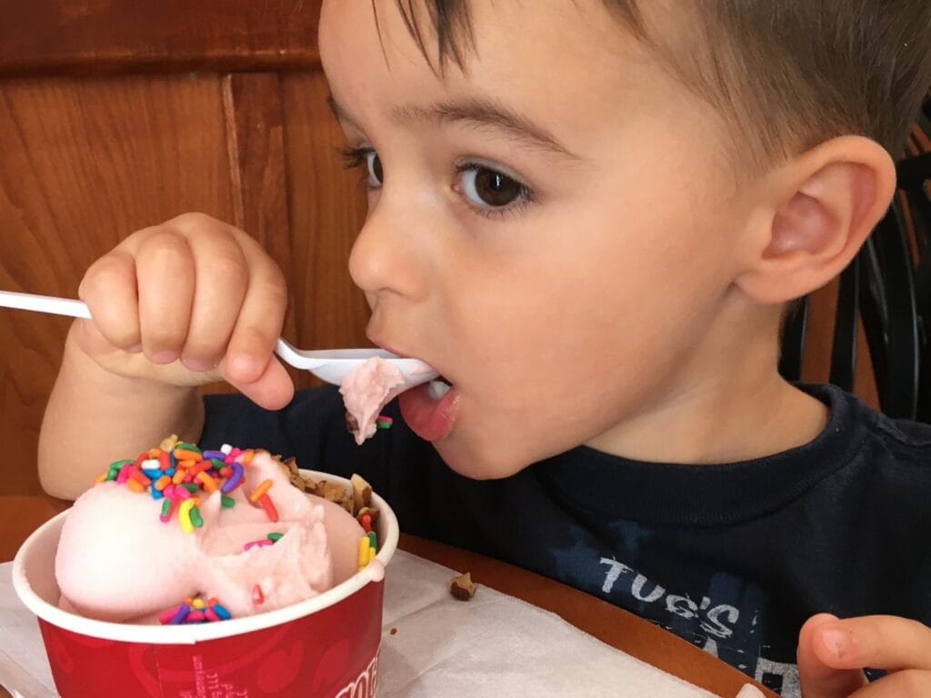 Boy eating Coldstone ice cream