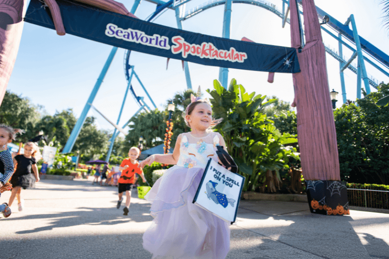 Kids running to get candy at SeaWorld's Spooktacular