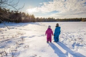 Orlando International Airport(MCO). Two children holding hands in the snow
