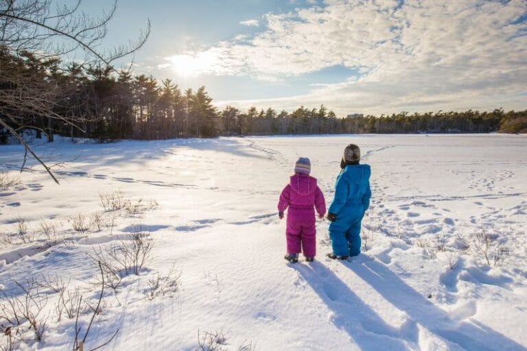 Orlando International Airport(MCO). Two children holding hands in the snow