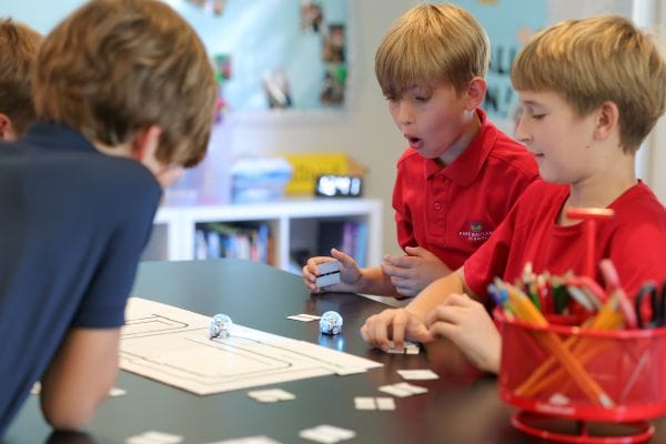 elementary school aged boys playing a game at school