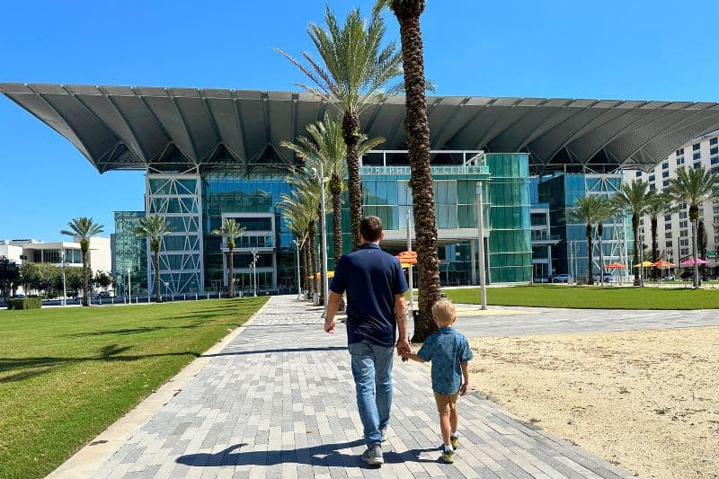 father and son walk towards Dr. Phillips Center for AdventHealth Broadway in Orlando at Dr Phillips Center for the Performing Arts with Kids - image by Dani Meyering