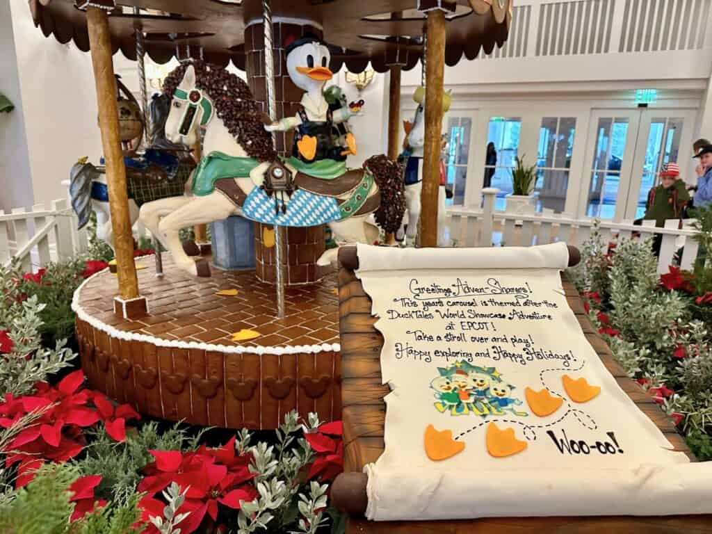 Disneys Beach Club Resort Gingerbread Carousel With Duck Tales Characters and Sign Describing the Carousel theme