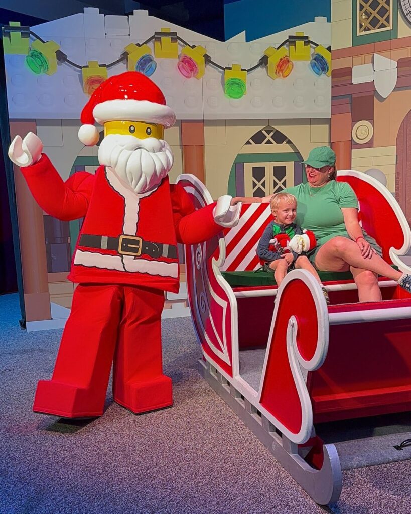 LEGO Santa with young boy and mother in Sleigh 