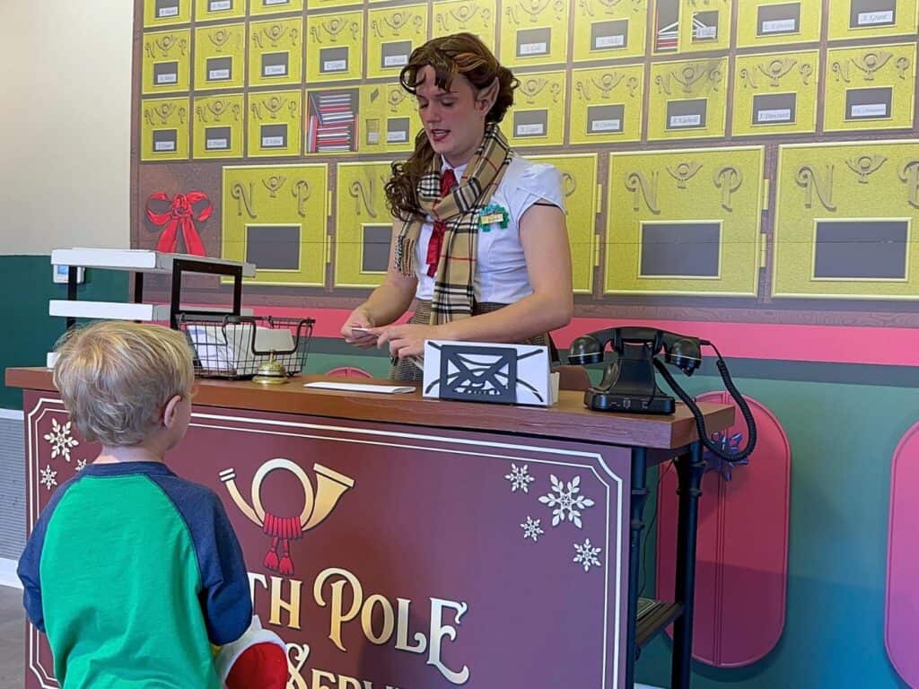 young boy at desk of North Pole Postal Service LEGOLAND Florida 