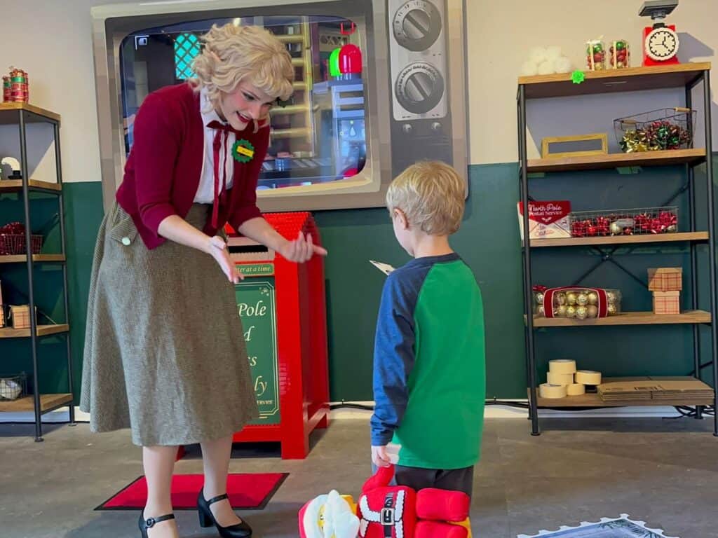Young Boy participates in North Pole Postal Service LEGOLAND Florida