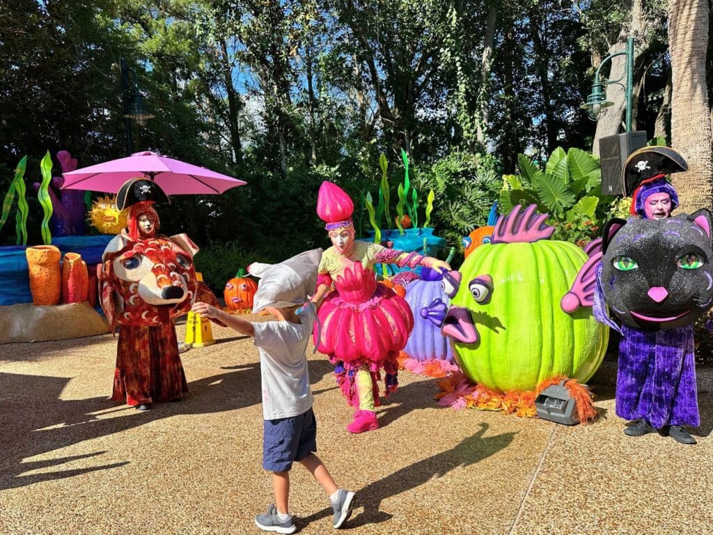 Young boy performer with characters at SeaWorld Orlando Spooktacular - image by Dani Meyering