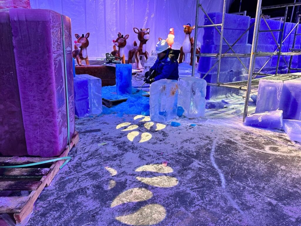 Ice Carvers Artisan works on Rudolph Reindeer sculptures at ICE! Gaylord Palms - image by Dani Meyering
