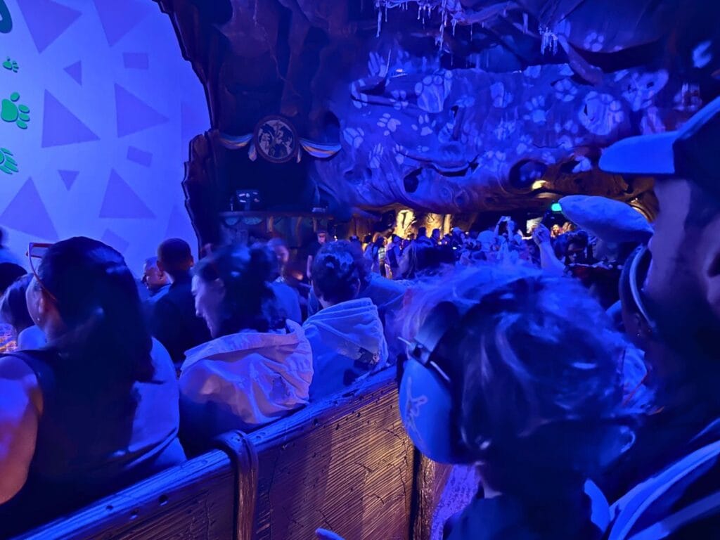 Zootopia Better Zoogether at Animal Kingdom boy and his father sit inside Tree of Life theater  - image by Dani Meyering